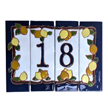 Load image into Gallery viewer, A set of ceramic house number tiles with a lemons and oranges design, dark blue edges, and a navy blue border.